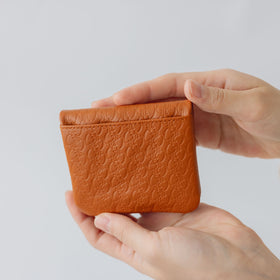 COSMIC WONDER monogram embossed light leather bifold coin case