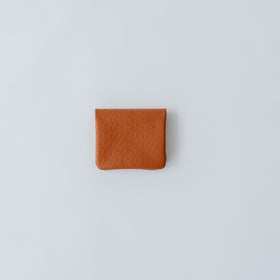 COSMIC WONDER monogram embossed light leather bifold coin case