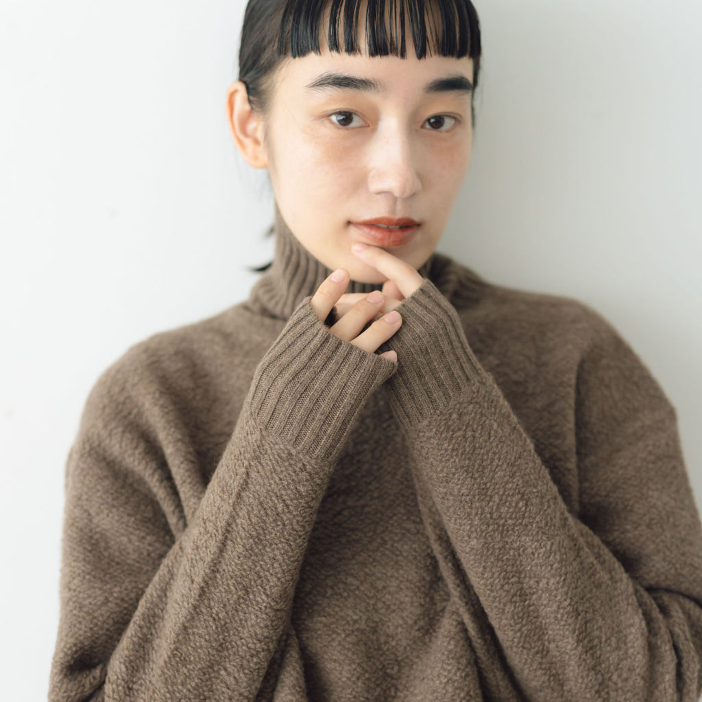 HAU ニットトップス "wool pile"