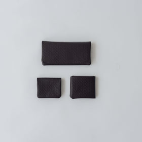 COSMIC WONDER monogram embossed light leather  bifold coin case
