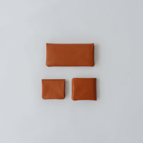 COSMIC WONDER monogram embossed light leather  bifold coin case