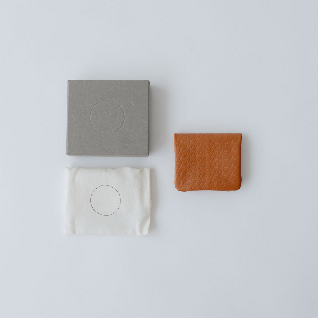 COSMIC WONDER monogram embossed light leather  bifold coin case