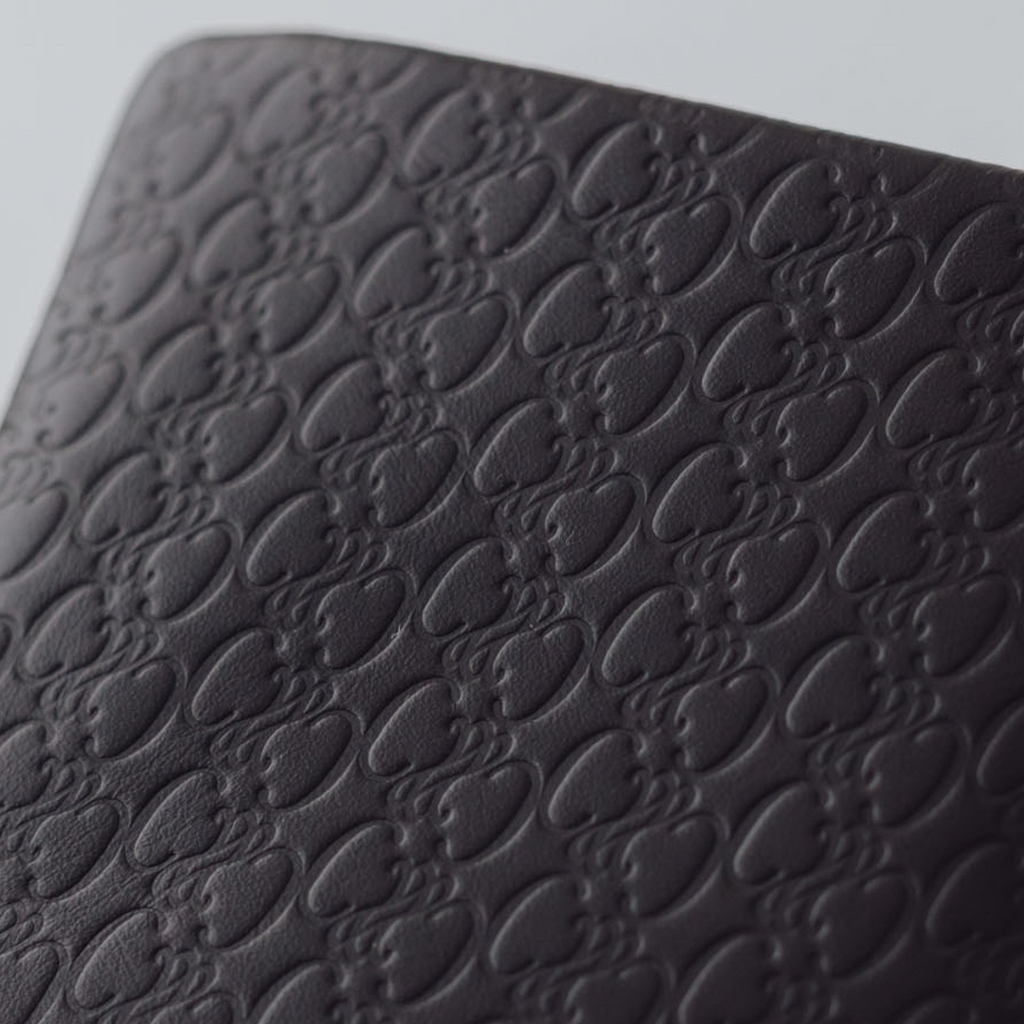 COSMIC WONDER monogram embossed light leather  bifold coin case